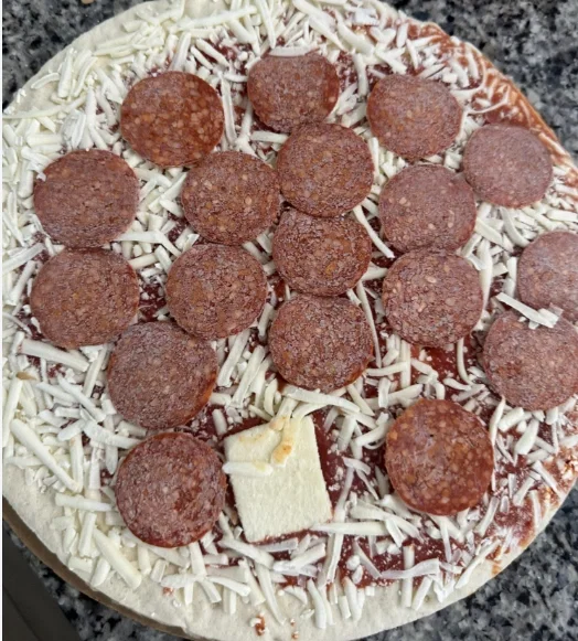 A block of cheese on my frozen pizza