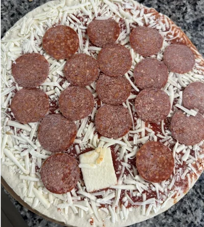 A block of cheese on my frozen pizza