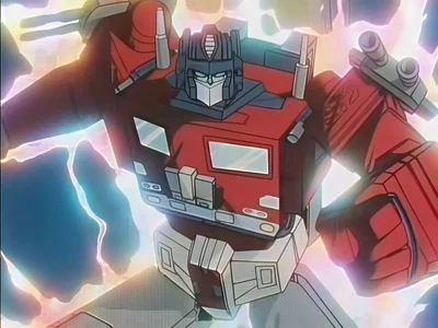 He looks like Optimus Prime but isn't. He is mistakenly called Optimus in the dub. It's confusing because sometimes other characters are on purposely called Optimus in the dub but this guy isn't even part of the Convoy archetype. He kinda looks like Optimu