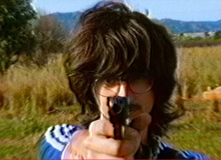 Pablo/ One of your best friends pointing a gun at you for a girl he loves that doesn't give that love back, you've told him he has to forget her but he's insanely obssessed to the point he would all of his friends to spend time with her because being with her is like a "nuclear attack" and "World-wide catastrophe"