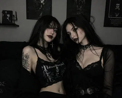 Your two scary and dominant Goth Girlfriends.